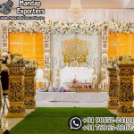 Traditional Indian wedding stage,Ganesh wedding backdrop decoration,Hindu wedding stage setup Golden wedding backdrop panels,Indian wedding elephant decoration ,Lord Ganesha stage decoration ,Grand wedding reception stage, Indian cultural wedding décor ,Royal mandap stage design,Luxury Hindu wedding setup