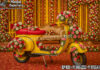 Vibrant Haldi Mehndi Colorful Entry Scooter Prop Vibrant Haldi Mehndi Colorful Entry Scooter Prop For Traditional Indian Bride Entry with colorful motifs and elegant bridal seating