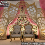 Luxury Wedding Backdrop, Golden Metal Frame Wedding Decor, Outdoor Wedding Stage Design, Wedding Floral Arch Setup, Modern Wedding Backdrop Ideas, Engagement Ceremony Decoration, Destination Wedding Stage, Garden Wedding Decoration, Wedding Sofa with Arch, Stylish Wedding Backdrop Manufacturer India.