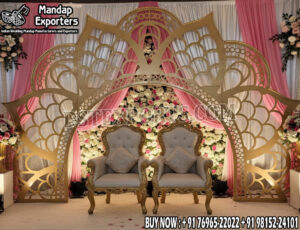 Luxury Wedding Backdrop, Golden Metal Frame Wedding Decor, Outdoor Wedding Stage Design, Wedding Floral Arch Setup, Modern Wedding Backdrop Ideas, Engagement Ceremony Decoration, Destination Wedding Stage, Garden Wedding Decoration, Wedding Sofa with Arch, Stylish Wedding Backdrop Manufacturer India.
