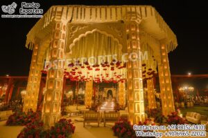 Rajwada wedding mandap, jharokha pillars mandap, royal theme wedding decor, Indian traditional mandap, luxury wedding stage setup, palace style mandap, fiber wedding mandap, Indian marriage mandap exporters, destination wedding decor, Rajasthan theme mandap, Indian mandap manufacturers, DST Exports mandap, grand royal mandap design, illuminated wedding mandap, handcrafted mandap structure.