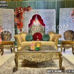 Arabic Style Mehndi Stage, Mehndi Stage Decor India, Luxury Mehndi Furniture Set, Golden Carved Stage Sofa, Arabic Wedding Stage Design, Mehndi Event Setup, Indian Wedding Stage Furniture, Royal Mehndi Decoration, Fiber Backdrop Panels for Wedding, Middle Eastern Style Stage, DST Exports Mehndi Setup, Sangeet Stage Furniture, Wedding Decor Manufacturers India, Wedding Sofa Set Exporters, Event Decor Furniture for Hire