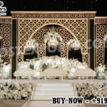 Arabian Wedding Stage ,Laser Cut Wooden Backdrop ,Moroccan Wedding Stage ,Arabian Theme Wedding Stage ,Luxury Wedding Stage Setup ,Laser Cut Panel Wedding Décor ,Gold & Black Wedding Backdrop ,Muslim Wedding Stage Design ,Royal Wedding Backdrop Panels ,Wedding Stage for Walima ,Arabian Style Mandap ,Laser Cut Arch Wedding Stage,Wedding Backdrop Manufacturer India ,Wedding Stage Exporter ,Designer Wedding Stage Furniture ,Custom Wedding Stage Panels ,Destination Wedding Backdrop