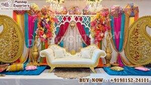 Luxury Mehndi decor setup, Sangeet function stage decoration, Indian wedding backdrop, royal wedding stage decor, colorful mehndi stage, traditional Indian wedding decor, Rajasthani umbrella wedding decor, mehndi ceremony setup, sangeet night decoration, Indian wedding sofa stage, destination wedding decor India, wedding stage setup exporter, mandap exporters India, wedding decor for USA UK Australia, luxury wedding backdrop, mehndi stage decoration supplier, Indian wedding event decor, handcrafted wedding stage, reusable wedding decor setup, DST Home Furniture wedding decor