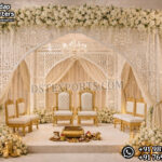 Luxury White Laser Cut Wedding Mandap For Australia featuring intricate laser cut backdrop panels, colorful floral arrangements, traditional lanterns, and royal wedding sofa