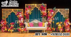 Luxury Moroccan Mehndi stage decor featuring intricate laser cut backdrop panels, colorful floral arrangements, traditional lanterns, and royal wedding sofa