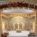 Bollywood Wedding Mandap USA, Outdoor Indian Wedding Stage, Destination Wedding Mandap, Luxury Fiber Mandap, Indian Mandap for Resort Wedding, Grand Indian Wedding Decor, Outdoor Mandap Setup, Bollywood Style Mandap, White Carved Mandap for Wedding, Indian Wedding Stage Exporter, Mandap Exporters USA, Royal Wedding Mandap, Elegant Fiber Wedding Mandap, Destination Wedding Decoration