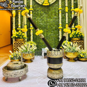 Traditional Rolu and Ammikallu arrangement for South Indian Pasupu Kottadam haldi ceremony with floral decorations.
