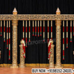 arangetram stage decoration, classical dance stage setup, Bharatanatyam stage decor, South Indian stage decoration, temple style stage backdrop, carved pillar stage design, cultural event stage decor India, traditional performance stage setup, Indian classical dance stage backdrop, arangetram decor supplier, stage decor exporters India, gold carved stage panels, Indian cultural stage decoration, auditorium stage decor setup, heritage style stage backdrop