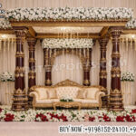 South Indian wedding mandap, Kalyana mandapam setup, luxury wedding mandap for sale, carved wooden mandap, traditional Indian wedding stage, royal wedding mandap design, temple style mandap, premium wedding mandap decor, gold carved mandap, wedding stage backdrop India, floral wedding mandap setup, Indian wedding furniture supplier, mandap exporters India, wedding mandap manufacturers, wooden wedding pillars mandap, Hindu wedding mandap decoration, luxury mandap for destination wedding, banquet hall mandap setup, designer wedding stage furniture, classic Indian mandap design