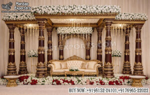 South Indian wedding mandap, Kalyana mandapam setup, luxury wedding mandap for sale, carved wooden mandap, traditional Indian wedding stage, royal wedding mandap design, temple style mandap, premium wedding mandap decor, gold carved mandap, wedding stage backdrop India, floral wedding mandap setup, Indian wedding furniture supplier, mandap exporters India, wedding mandap manufacturers, wooden wedding pillars mandap, Hindu wedding mandap decoration, luxury mandap for destination wedding, banquet hall mandap setup, designer wedding stage furniture, classic Indian mandap design