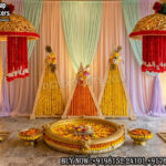 haldi stage decoration, marigold haldi backdrop, haldi ceremony setup India, haldi decor with urli, traditional haldi stage design, floral haldi backdrop ideas, mehndi haldi stage decor, marigold wedding decoration setup, haldi stage with flowers, urli decoration for haldi, Indian wedding haldi decor, colorful haldi backdrop design, haldi stage with umbrella decor, festive wedding stage setup, daytime wedding decoration ideas, haldi decor supplier India, wedding decor exporters India, floral backdrop haldi ceremony