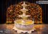 Royal White Lotus Water Fountain for Wedding Entrance Decor Royal white lotus tiered water fountain for wedding entrance decoration with LED lights and floral backdrop setup