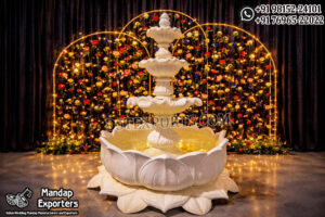 Royal white lotus tiered water fountain for wedding entrance decoration with LED lights and floral backdrop setup