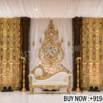 tamil wedding stage decoration, nichayathartham stage decor, south indian wedding stage setup, temple style wedding stage, ganesh wedding backdrop, indian wedding stage decor, traditional engagement stage India, carved pillar wedding stage, luxury wedding stage setup, wedding decor exporters India, mandap manufacturers India, cultural wedding stage decoration, banquet hall wedding stage design, premium wedding stage decor India