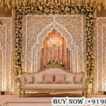 Arabian wedding backdrop, laser cut wedding backdrop, palace style wedding stage, luxury wedding backdrop, carved wedding panels, royal wedding décor, floral wedding stage backdrop, wedding reception backdrop, decorative wedding panels, elegant stage backdrop, luxury event backdrop, wedding stage decoration, palace theme backdrop, wedding décor manufacturers, laser cut décor panels
