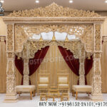 Royal Indian wedding mandap, Haveli style mandap, luxury wedding mandap, carved wedding mandap, traditional Indian mandap, Hindu wedding stage décor, palace style wedding mandap, designer wedding mandap, royal mandap for wedding, carved wooden mandap, destination wedding mandap, premium wedding canopy, wedding ceremony mandap, Maharaja style mandap, ornate wedding stage, Indian bridal mandap, luxury mandap décor, handcrafted wedding mandap, wedding pavilion décor, royal wedding setup, wedding stage backdrop, elegant Indian mandap, heritage style wedding mandap, decorative marriage mandap, wedding décor structure, traditional carved mandap, Indian wedding canopy, grand wedding mandap setup, luxury event mandap, royal stage decoration