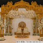 ganesha wedding mandap, luxury wedding mandap, hindu wedding stage, royal mandap decoration, carved wedding mandap, traditional indian mandap, designer wedding mandap, floral wedding mandap, premium wedding stage decor, double pole wedding mandap, hindu marriage mandap, luxury event mandap, ganesha theme decor, wedding backdrop setup, ornate wedding mandap