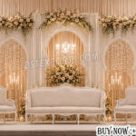 Luxury Nikkah Stage Decoration, Wedding Stage Backdrop, Modern Arched Wedding Panels, Royal Wedding Stage Setup, Elegant Muslim Wedding Stage, Moroccan Style Wedding Backdrop, White Wedding Stage Decoration, Luxury Reception Stage Decor, Floral Wedding Backdrop Panels, Premium Wedding Stage Furniture, Mandap Exporters Wedding Stage, Designer Wedding Backdrop, Wedding Arch Panels, Luxury Event Decor, Indian Wedding Stage Manufacturer, Royal Nikkah Setup, Floral Stage Decoration, Contemporary Wedding Stage Design, Wedding Stage Exporter India, Elegant Wedding Sofa Set
