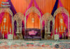 Premium Laser-Cut Metal Backdrop for Mehndi & Sangeet Ceremonies reception stage decor, laser cut metal backdrop, floral wedding stage, candle wall backdrop, luxury reception stage, wedding stage decoration, elegant wedding backdrop, floral wall decor, wedding sofa stage setup, metal panel backdrop, crystal hanging backdrop, royal wedding stage, luxury event decor, wedding stage furniture, mandap exporters decor