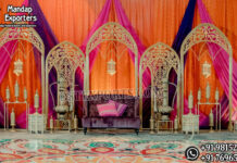 Premium Laser-Cut Metal Backdrop for Mehndi & Sangeet Ceremonies reception stage decor, laser cut metal backdrop, floral wedding stage, candle wall backdrop, luxury reception stage, wedding stage decoration, elegant wedding backdrop, floral wall decor, wedding sofa stage setup, metal panel backdrop, crystal hanging backdrop, royal wedding stage, luxury event decor, wedding stage furniture, mandap exporters decor