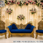 walima stage decor, blue velvet sofa set, luxury wedding sofa, royal wedding furniture, walima stage setup, antique gold sofa set, wedding reception stage décor, velvet wedding seating, premium stage decoration, bridal stage sofa, carved wedding furniture, designer walima décor, luxury event furniture, wedding stage manufacturers, elegant wedding setup, floral wedding backdrop, royal sofa chairs, wedding lounge furniture, reception stage décor, luxury bridal seating