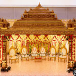 Premium handcrafted South Indian Shikhara style wooden wedding mandap. Features traditional Dravidian temple architecture, multi-tiered carved roofs, and gold-walnut finish. Worldwide shipping available. Request a quote.