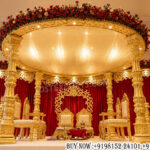 South Indian wedding mandap, Avni mandap decor, muhurtham mandap, traditional wedding mandap, luxury wedding mandap, carved wedding canopy, golden wedding mandap, Hindu wedding decor, royal mandap setup, Indian wedding stage decoration, temple style mandap, wedding canopy design, premium wedding mandap, floral wedding mandap, bridal mandap decoration, cultural wedding setup, ornate wedding pillars, designer mandap manufacturers,
