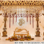 traditional wedding mandap, elephant carved wedding mandap, hindu wedding mandap, luxury wedding mandap, carved pillar mandap, royal mandap decoration, indian wedding stage decor, premium wedding mandap, floral wedding mandap, designer mandap setup, luxury hindu mandap, wedding stage backdrop, traditional indian mandap, decorative wedding pillars, royal wedding decor