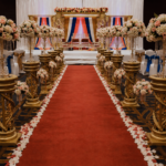 Tamil wedding mandap, golden FRP mandap, crystal wedding mandap, traditional Hindu mandap, South Indian wedding décor, luxury wedding mandap, carved FRP pillars, Tamil marriage mandap, Sankheda wedding seating, wedding ceremony mandap, floral mandap decoration, premium wedding stage, decorative mandap pillars, Indian wedding canopy, royal wedding mandap setup, banquet hall mandap décor, engagement ceremony mandap, handcrafted wedding mandap, cultural wedding stage, designer wedding mandap, luxury Hindu wedding setup, FRP wedding décor, traditional marriage stage, elegant mandap decoration, destination wedding mandap