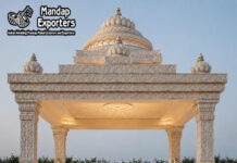 Traditional Temple Style Mandap with Lotus Carved Dome south indian wedding mandap, temple style wedding mandap, manavarai mandap design, hindu wedding mandap decoration, white gold wedding mandap, traditional wedding mandap India, luxury wedding mandap setup, carved mandap pillars, muhurtham stage decoration, wedding mandap exporters India, premium mandap design, temple theme wedding decor, indian wedding stage mandap, decorative mandap supplier