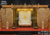 Dravidian Carved Pillars With Panels for Ritu Kala Samskaram Luxurious traditional Ritu Kala Samskaram stage featuring intricately carved Dravidian wooden pillars, decorative floral panels, hanging garlands, temple-style backdrop, and elegant ceremonial seating.
