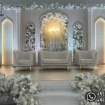 Luxury Nikkah Stage Decoration, Wedding Stage Backdrop, Modern Arched Wedding Panels, Royal Wedding Stage Setup, Elegant Muslim Wedding Stage, Moroccan Style Wedding Backdrop, White Wedding Stage Decoration, Luxury Reception Stage Decor, Floral Wedding Backdrop Panels, Premium Wedding Stage Furniture, Mandap Exporters Wedding Stage, Designer Wedding Backdrop, Wedding Arch Panels, Luxury Event Decor, Indian Wedding Stage Manufacturer, Royal Nikkah Setup, Floral Stage Decoration, Contemporary Wedding Stage Design, Wedding Stage Exporter India, Elegant Wedding Sofa Set