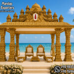 South Indian temple mandap, luxury wedding mandap decor, temple style wedding stage, traditional wedding mandap, grand wedding backdrop, white and gold mandap, carved wedding stage, premium wedding decor, Indian wedding stage setup, royal wedding mandap, handcrafted mandap design, South Indian wedding decor, designer wedding stage, ornate temple backdrop, luxury wedding furniture, wedding event decor manufacturer, carved pillar mandap, wedding reception stage, Hindu wedding mandap setup