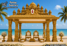 Grand Gopuram Temple Style Mandap For Destination Weddings South Indian temple mandap, luxury wedding mandap decor, temple style wedding stage, traditional wedding mandap, grand wedding backdrop, white and gold mandap, carved wedding stage, premium wedding decor, Indian wedding stage setup, royal wedding mandap, handcrafted mandap design, South Indian wedding decor, designer wedding stage, ornate temple backdrop, luxury wedding furniture, wedding event decor manufacturer, carved pillar mandap, wedding reception stage, Hindu wedding mandap setup