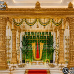 South Indian temple mandap, luxury wedding mandap decor, temple style wedding stage, traditional wedding mandap, grand wedding backdrop, white and gold mandap, carved wedding stage, premium wedding decor, Indian wedding stage setup, royal wedding mandap, handcrafted mandap design, South Indian wedding decor, designer wedding stage, ornate temple backdrop, luxury wedding furniture, wedding event decor manufacturer, carved pillar mandap, wedding reception stage, Hindu wedding mandap setup