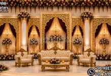 Luxury Mehrab Style Backdrop for Elite Wedding and Reception Decor Royal wedding stage, Indian wedding reception stage, luxury wedding mandap, palace style wedding stage, South Indian wedding stage, carved wedding backdrop, royal mandap design, elephant wedding stage, grand wedding stage decoration, traditional Indian wedding setup, designer mandap stage, wedding stage for reception, luxury wedding décor, white carved mandap, Maharaja style wedding stage, premium wedding backdrop, handcrafted wedding mandap, floral wedding stage, wedding event stage, decorative mandap setup