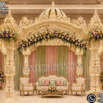 South Indian temple mandap, luxury wedding mandap decor, temple style wedding stage, traditional wedding mandap, grand wedding backdrop, white and gold mandap, carved wedding stage, premium wedding decor, Indian wedding stage setup, royal wedding mandap, handcrafted mandap design, South Indian wedding decor, designer wedding stage, ornate temple backdrop, luxury wedding furniture, wedding event decor manufacturer, carved pillar mandap, wedding reception stage, Hindu wedding mandap setup