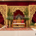 walima stage décor, paisley wedding backdrop, luxury walima setup, golden paisley panels, royal wedding stage, carved paisley backdrop, wedding reception décor, designer walima stage, Islamic wedding stage décor, luxury wedding backdrop, decorative paisley frames, banquet hall wedding setup, premium stage decoration, ornate wedding backdrop, wedding couple seating, handcrafted wedding décor, elegant walima backdrop, destination wedding stage, cultural wedding décor, floral wedding setup, royal event stage, luxury stage furniture, decorative wedding panels, Asian wedding stage décor, premium walima decoration