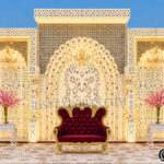 destination wedding mandap, fusion wedding pavilion mandap, luxury wedding canopy, outdoor wedding mandap, white and gold wedding mandap, laser cut wedding mandap, Islamic style wedding mandap, Mughal inspired mandap, royal wedding pavilion, designer wedding mandap setup, premium wedding mandap décor, floral wedding mandap, crystal hanging mandap, luxury phera mandap, wedding stage decoration, modern wedding mandap design, elegant wedding canopy setup, destination wedding decor Royal Mughal Wedding Stage Backdrop, Mughal Arch Wedding Backdrop, Fiber Wedding Stage Panels, Luxury Wedding Stage Decor, Arabic Wedding Backdrop, Muslim Wedding Stage Setup, Nikkah Stage Decoration, Walima Stage Backdrop, Reception Stage Design, Wedding Backdrop Manufacturer, FRP Wedding Panels, Carved Wedding Backdrop, Indian Wedding Stage Decor, Heritage Wedding Backdrop, Dome Arch Backdrop Panels, Event Stage Decoration, Wedding Furniture Set, Royal Wedding Sofa Set, Bride Groom Stage Setup