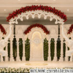 Royal wedding stage, Indian wedding reception stage, luxury wedding mandap, palace style wedding stage, South Indian wedding stage, carved wedding backdrop, royal mandap design, elephant wedding stage, grand wedding stage decoration, traditional Indian wedding setup, designer mandap stage, wedding stage for reception, luxury wedding décor, white carved mandap, Maharaja style wedding stage, premium wedding backdrop, handcrafted wedding mandap, floral wedding stage, wedding event stage, decorative mandap setup
