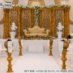 Luxury Wedding Stage Setup, Golden Wedding Stage, Royal Wedding Backdrop, Wedding Reception Stage Decor, Indian Wedding Stage Decoration, Luxury Wedding Decor, Golden Backdrop Panels, Wedding Stage Design, Maharaja Wedding Stage, Wedding Sofa Stage Setup, Royal Reception Backdrop, Luxury Event Decor, Wedding Stage Manufacturer, Wedding Stage Exporter, Decorative Wedding Panels, Wedding Decor Props, Grand Wedding Stage, South Indian Wedding Stage, Destination Wedding Decor, Premium Wedding Backdrop, Event Stage Decoration, Wedding Decoration Supplier, Wedding Rental Decor, Banquet Hall Stage Setup, Luxury Wedding Furniture