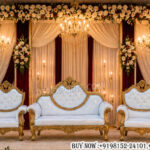wedding couple sofa set, bride groom sofa set, luxury wedding furniture, royal wedding sofa, 3-piece wedding sofa set, wedding reception seating, carved wedding sofa, bridal stage furniture, gold wedding sofa set, luxury bride groom chairs, designer wedding seating, wedding stage sofa, ornate wedding furniture, premium wedding décor, banquet hall wedding setup, reception stage furniture, royal wedding chairs, wedding event sofa set, luxury ceremonial seating, classic wedding sofa design, handcrafted wedding furniture, destination wedding décor, elegant wedding seating arrangement, wedding couple throne chairs, luxury event furniture