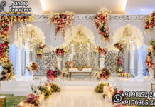 Fairytale Theme White Stage for Jewish Weddings destination wedding mandap, fusion wedding pavilion mandap, luxury wedding canopy, outdoor wedding mandap, white and gold wedding mandap, laser cut wedding mandap, Islamic style wedding mandap, Mughal inspired mandap, royal wedding pavilion, designer wedding mandap setup, premium wedding mandap décor, floral wedding mandap, crystal hanging mandap, luxury phera mandap, wedding stage decoration, modern wedding mandap design, elegant wedding canopy setup, destination wedding decor Royal Mughal Wedding Stage Backdrop, Mughal Arch Wedding Backdrop, Fiber Wedding Stage Panels, Luxury Wedding Stage Decor, Arabic Wedding Backdrop, Muslim Wedding Stage Setup, Nikkah Stage Decoration, Walima Stage Backdrop, Reception Stage Design, Wedding Backdrop Manufacturer, FRP Wedding Panels, Carved Wedding Backdrop, Indian Wedding Stage Decor, Heritage Wedding Backdrop, Dome Arch Backdrop Panels, Event Stage Decoration, Wedding Furniture Set, Royal Wedding Sofa Set, Bride Groom Stage Setup