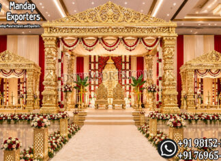 Grand Golden Manavarai Mandapam For Tamil Wedding Ceremony Grand Golden Tamil Manavarai Mandapam with intricately carved pillars and luxurious wedding stage décor for South Indian Hindu weddings, manufactured and exported for USA event planners, wedding decorators, banquet halls, and luxury wedding venues