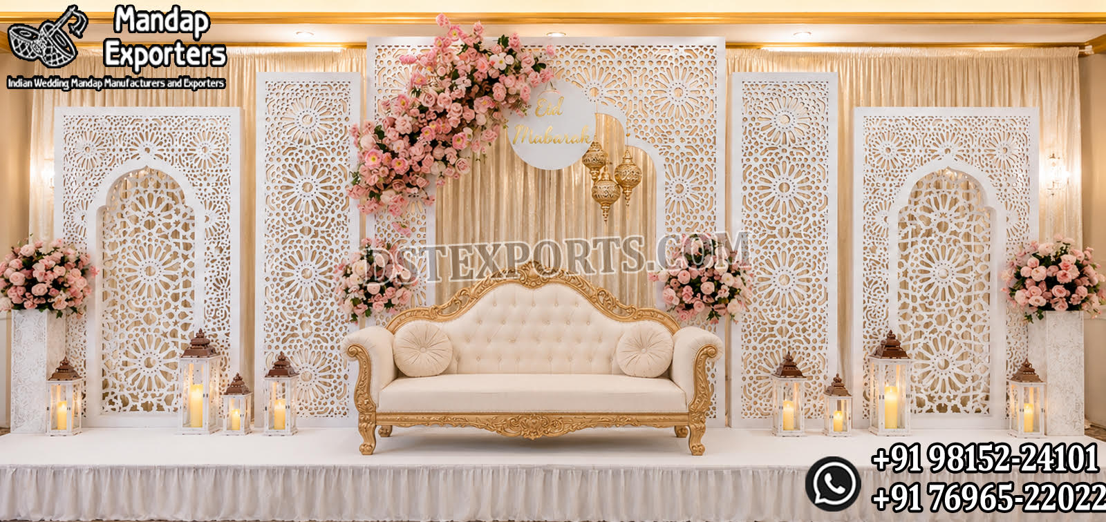 Royal wedding reception stage backdrop with white laser cut panels, luxury sofa and floral decorations for Australian wedding decorators.