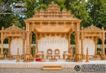 Grand Elephant Pillar Manavarai Wedding Mandap Grand Elephant Pillar Manavarai Wedding Mandap featuring intricately carved temple-style architecture, majestic elephant base pillars, decorative side pavilions, elegant ceremonial canopy, royal wedding chairs, and traditional South Indian craftsmanship. Premium FRP modular wedding mandap ideal for luxury Indian weddings, event decorators, banquet halls, hotels, resorts, and destination wedding venues in the USA.
