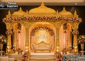 Grand Golden Mandap with Domes for Indian Weddings Grand golden Indian wedding mandap with royal domes, carved pillars, floral decorations, luxury stage backdrop and traditional Hindu wedding décor.