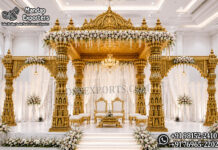 Premium Gold Carved Temple Style Wedding Mandap for USA Premium gold carved temple-style wedding mandap with decorative pillars, side arches and a grand crown for Indian weddings in the USA.
