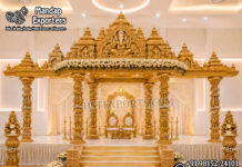South Indian Anmol Golden Carved Manavarai Mandap Set South Indian Anmol Golden Carved Manavarai Mandap Set with Temple Style Gopuram, Hand-Carved Pillars & Lord Ganesha | Luxury Wedding Mandap Manufacturer & Exporter for USA Event Planners